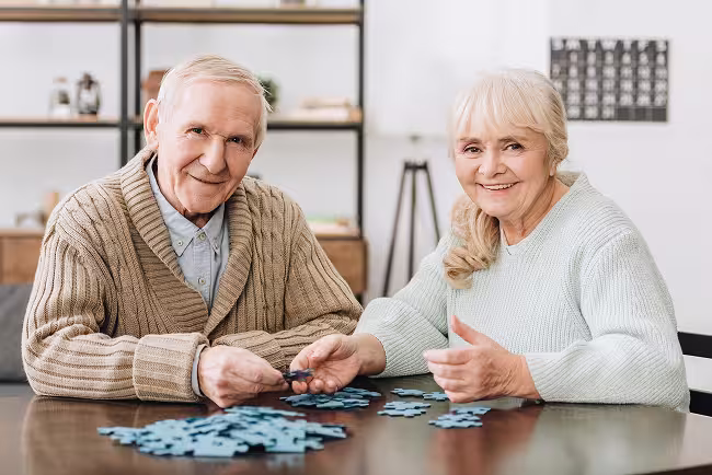 mature-couple-playing-puzzle