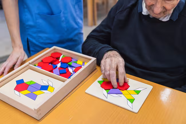 elderly-man-engaging-in-puzzle-activity